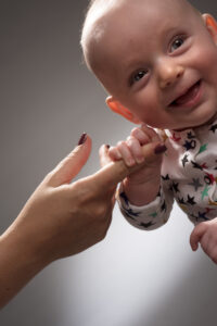 Baby holding Finger