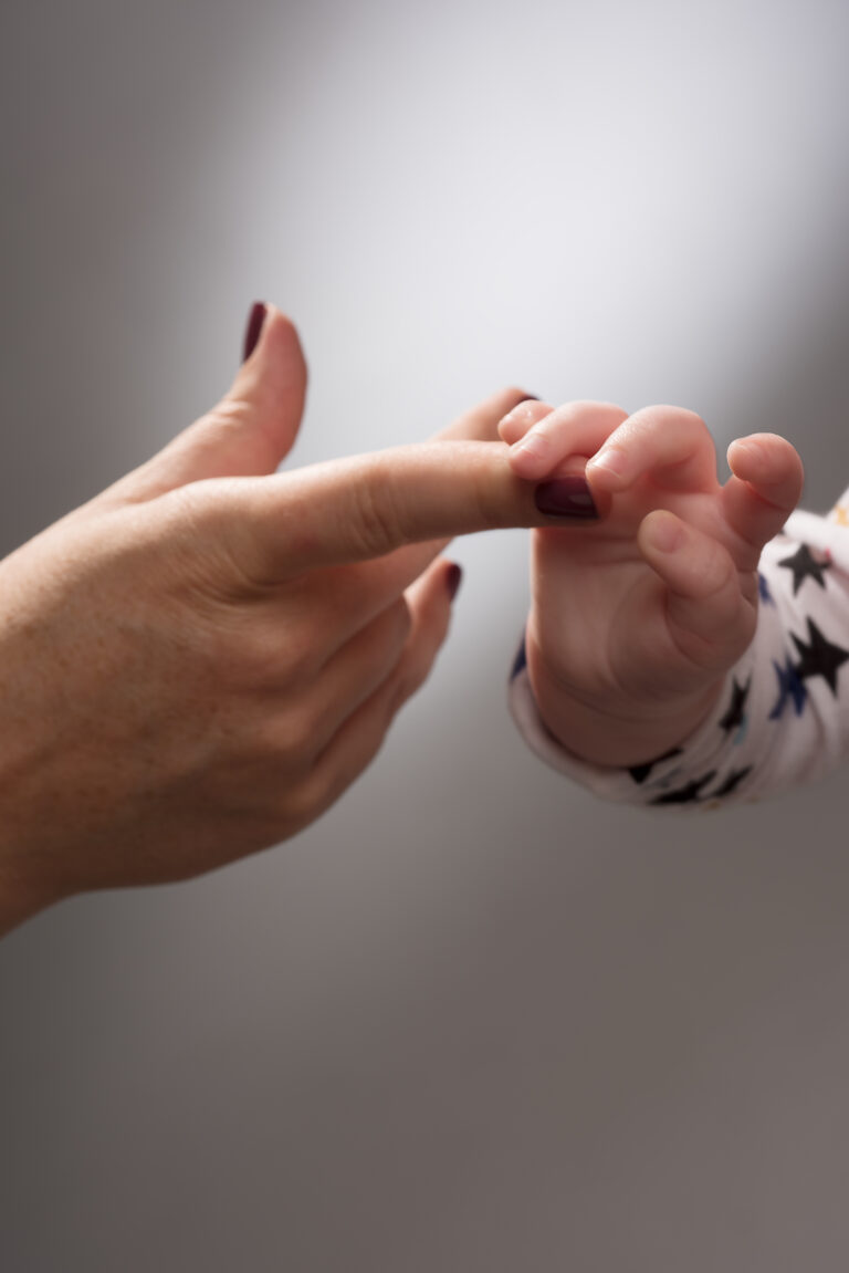 Baby holding Finger