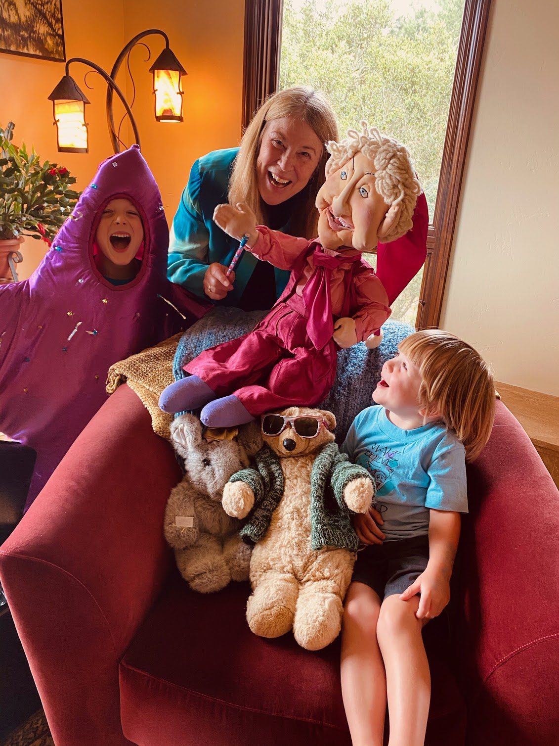 Kids laughing with stuffed animals